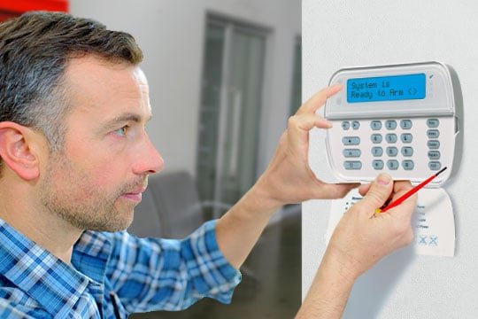 man-installing-panel-5 A professional doing alarm systems services in San Diego, CA